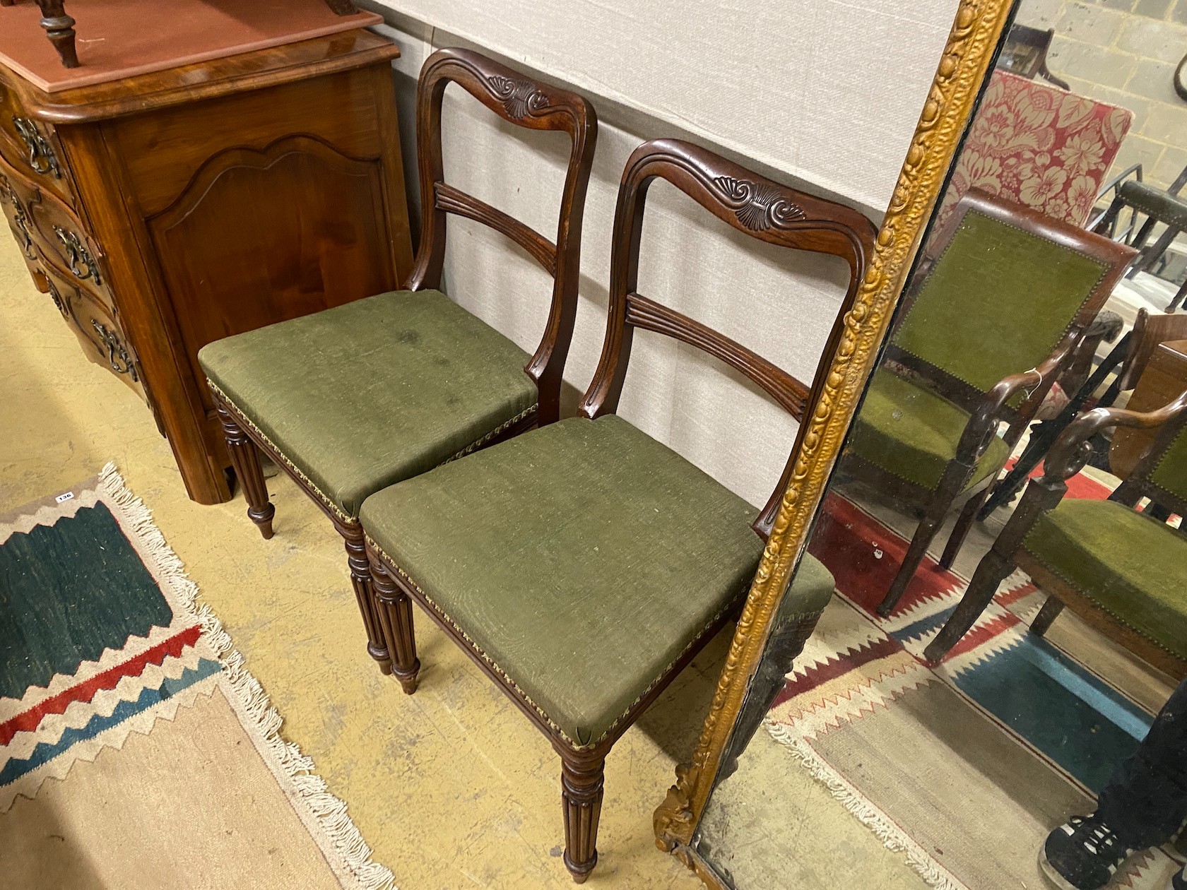 A set of eight early Victorian mahogany dining chairs on turned fluted legs